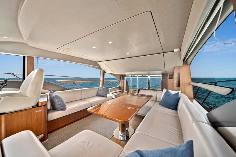 Mine Escape Yacht Photos Pics Luxurious interior of 2020 Princess F55 Flybridge yacht with ocean view.