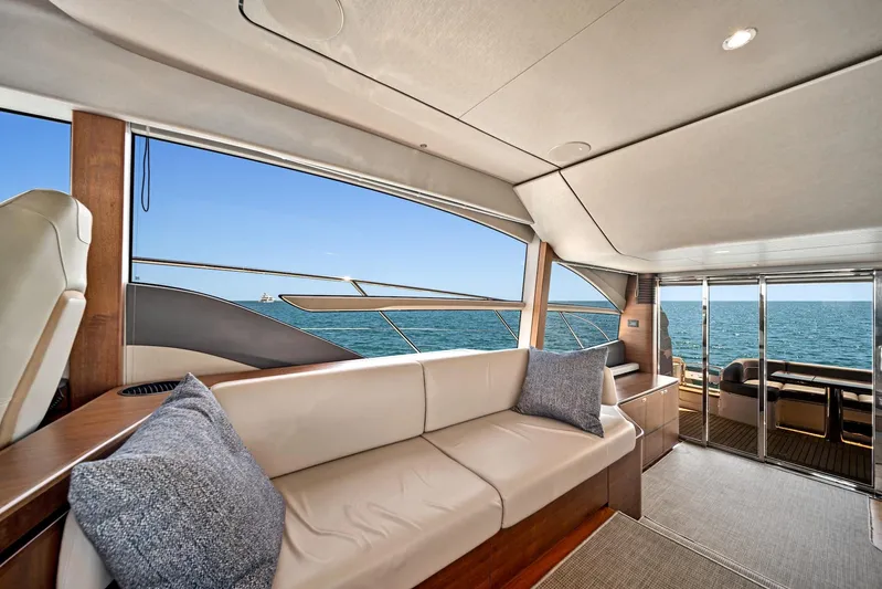 Mine Escape Yacht Photos Pics Interior of 2020 Princess F55 Flybridge yacht with ocean view through large windows.