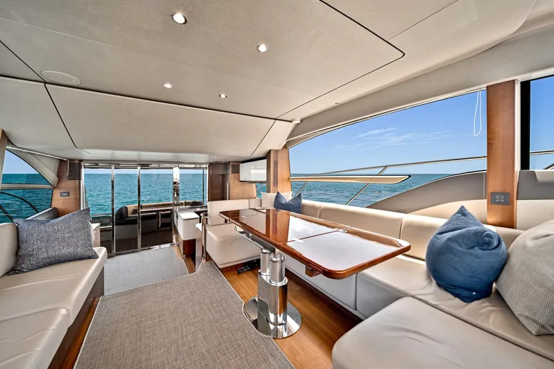 Mine Escape Yacht Photos Pics Luxurious interior of 2020 Princess F55 Flybridge yacht with ocean view.
