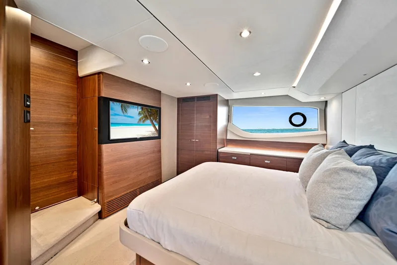 Mine Escape Yacht Photos Pics Luxurious bedroom interior of 2020 Princess F55 Flybridge yacht with ocean view.