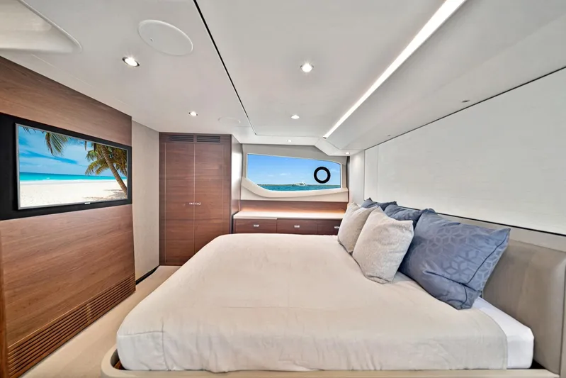 Mine Escape Yacht Photos Pics Luxurious bedroom interior of 2020 Princess F55 Flybridge yacht with ocean view.