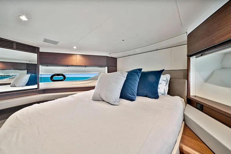 Mine Escape Yacht Photos Pics Luxurious bedroom interior of 2020 Princess F55 Flybridge yacht with ocean view.