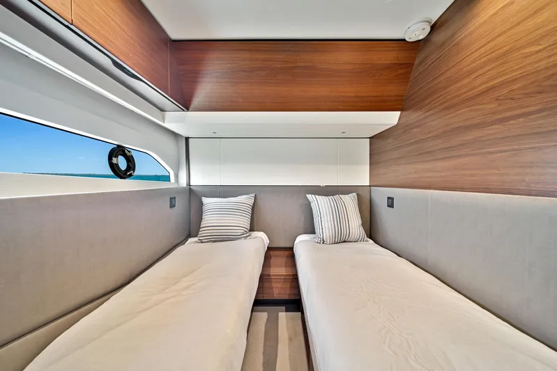 Mine Escape Yacht Photos Pics Twin beds in the 2020 Princess F55 Flybridge yacht cabin.