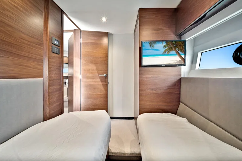 Mine Escape Yacht Photos Pics Interior cabin of 2020 Princess F55 Flybridge yacht with twin beds and TV.