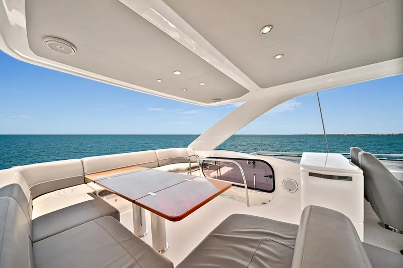 Mine Escape Yacht Photos Pics Flybridge seating area on a 2020 Princess F55 yacht with ocean view.