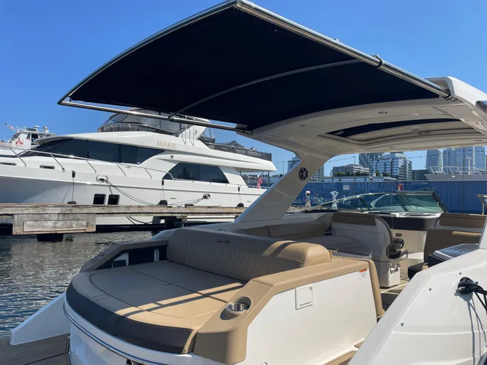  Yacht Photos Pics 2021 Sea Ray SLX 310 boat with canopy, docked at marina.