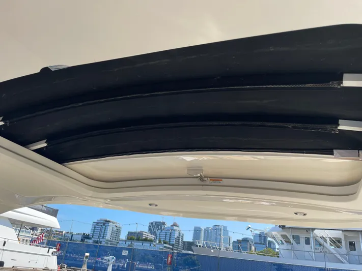  Yacht Photos Pics 2021 Sea Ray SLX 310 boat roof with cityscape in background.