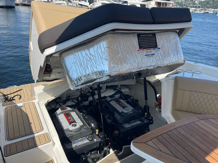  Yacht Photos Pics 2021 Sea Ray SLX 310 boat engine compartment with twin engines, docked by the water.