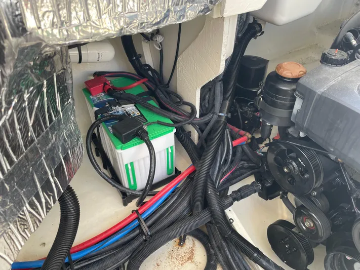  Yacht Photos Pics Engine compartment of a 2021 Sea Ray SLX 310 boat, showing battery and wiring.