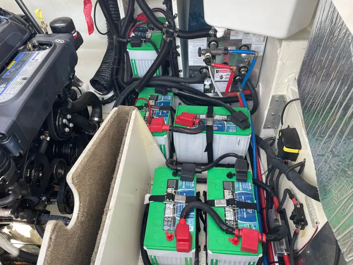  Yacht Photos Pics Engine compartment of 2021 Sea Ray SLX 310 with multiple batteries and wiring.