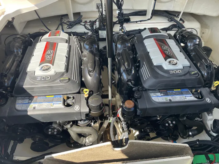  Yacht Photos Pics Twin engines of a 2021 Sea Ray SLX 310 boat, showcasing powerful performance.
