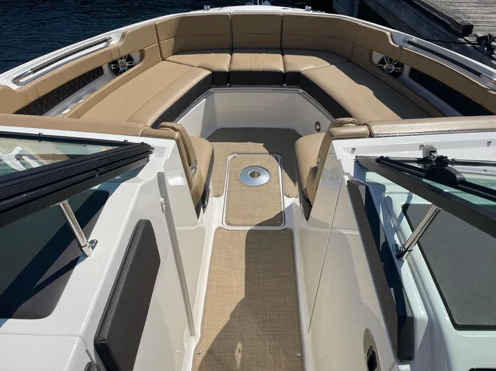  Yacht Photos Pics 2021 Sea Ray SLX 310 boat interior with tan seating and open deck.