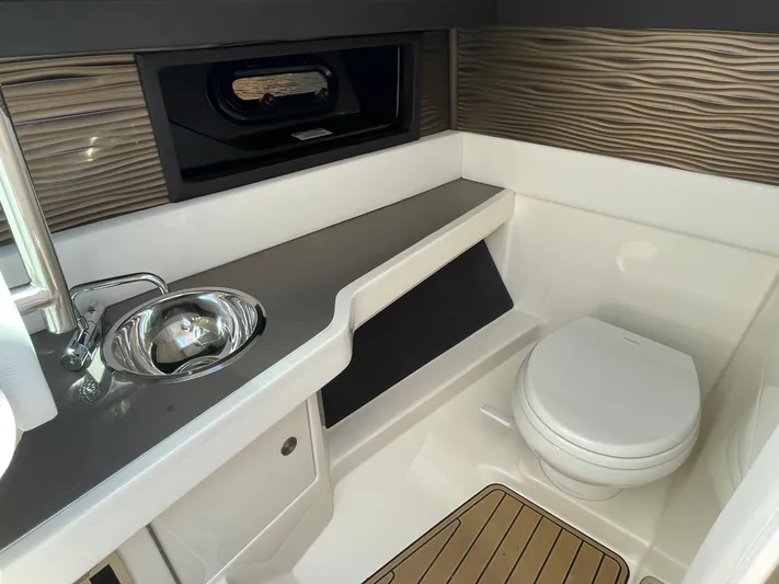  Yacht Photos Pics 2021 Sea Ray SLX 310 boat interior with sink and toilet.