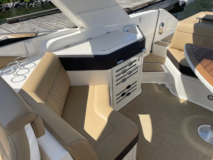  Yacht Photos Pics 2021 Sea Ray SLX 310 interior with beige seating and sleek design.
