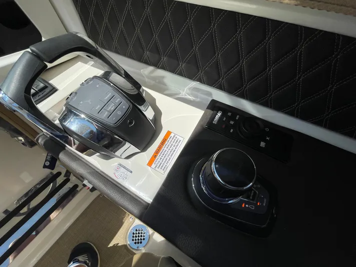 Yacht Photos Pics 2021 Sea Ray SLX 310 helm controls with joystick and steering wheel.
