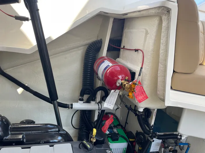  Yacht Photos Pics Engine compartment of 2021 Sea Ray SLX 310 with fire extinguisher and battery.