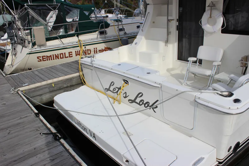  Yacht Photos Pics 2007 Silverton 36 Convertible yacht docked, featuring spacious deck and seating area.