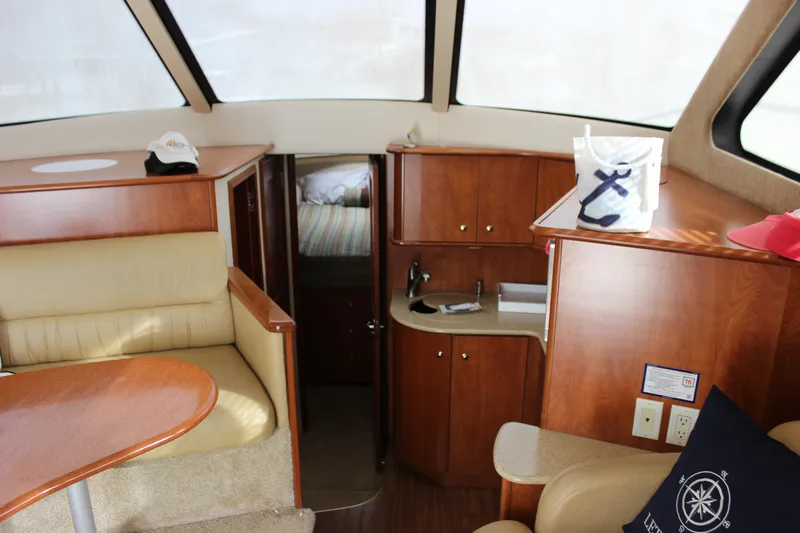  Yacht Photos Pics Interior of 2007 Silverton 36 Convertible yacht with wood cabinetry and seating.