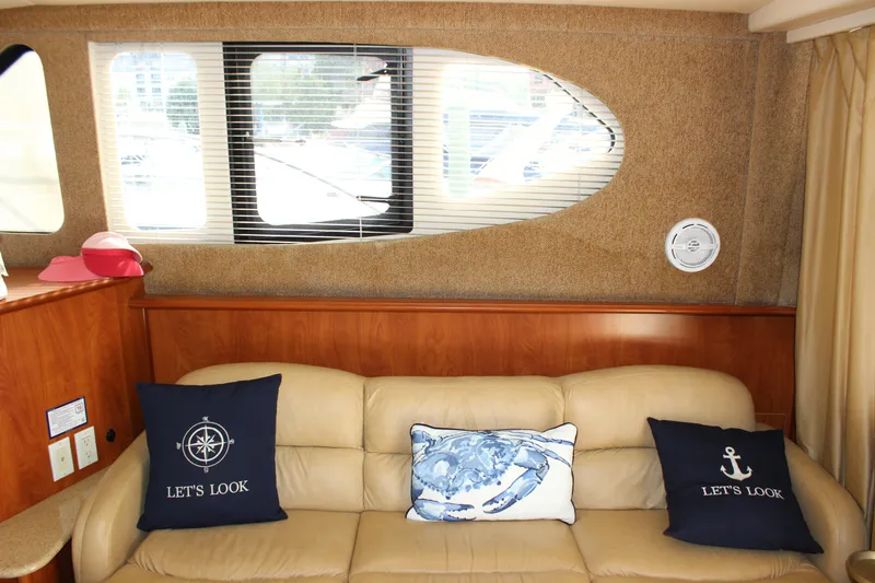  Yacht Photos Pics Interior of 2007 Silverton 36 Convertible yacht with beige sofa and nautical pillows.