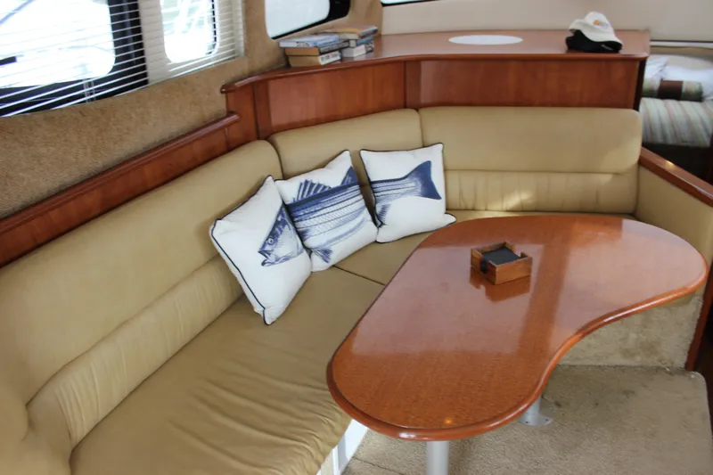  Yacht Photos Pics Luxurious interior of 2007 Silverton 36 Convertible yacht with plush seating and fish-themed pillows.