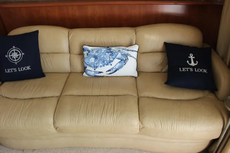  Yacht Photos Pics Beige leather sofa with nautical-themed pillows on a 2007 Silverton 36 Convertible.