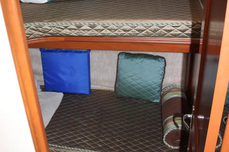  Yacht Photos Pics Interior of 2007 Silverton 36 Convertible with bunk beds and colorful cushions.