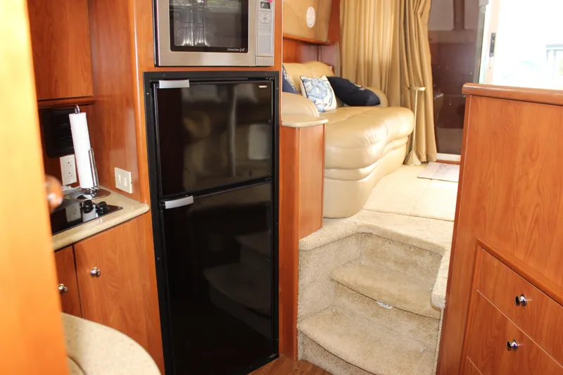  Yacht Photos Pics Interior of 2007 Silverton 36 Convertible yacht with kitchen and seating area.