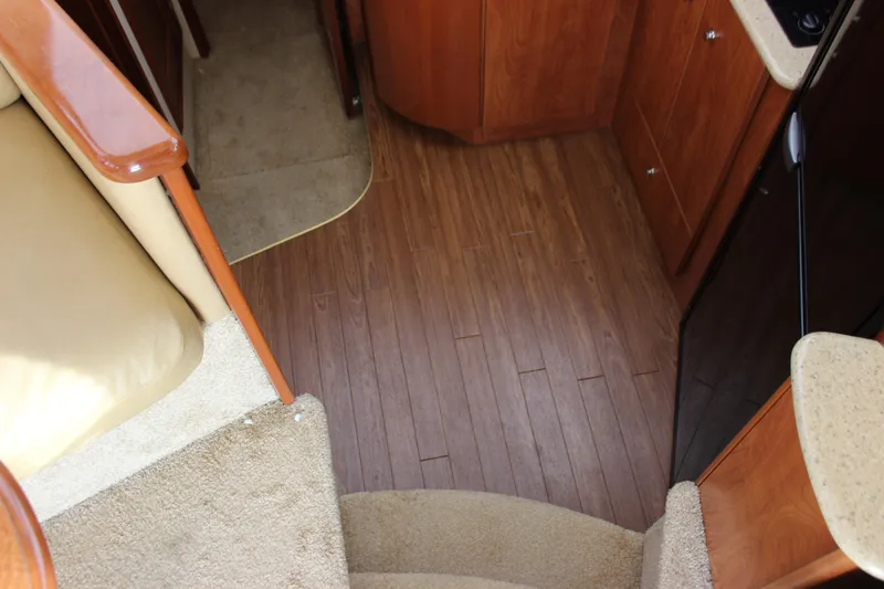  Yacht Photos Pics Interior view of 2007 Silverton 36 Convertible yacht with wooden flooring and carpeted stairs.