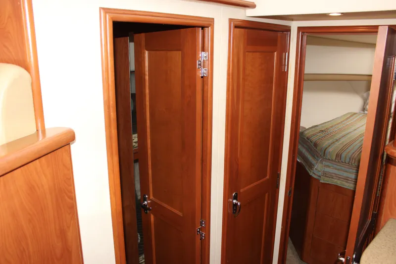  Yacht Photos Pics Interior of 2007 Silverton 36 Convertible yacht with wooden doors and cozy cabin.