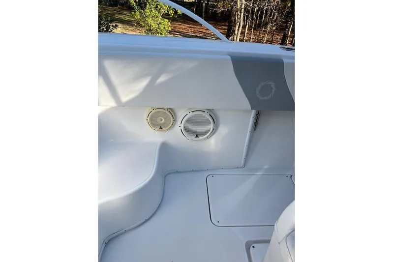 Sashimi Yacht Photos Pics 2006 Fountain 38 Tournament Edition boat interior with speakers and storage compartment.