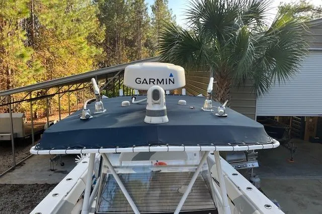 Sashimi Yacht Photos Pics 2006 Fountain 38 Tournament Edition boat with Garmin radar, surrounded by trees and a palm.