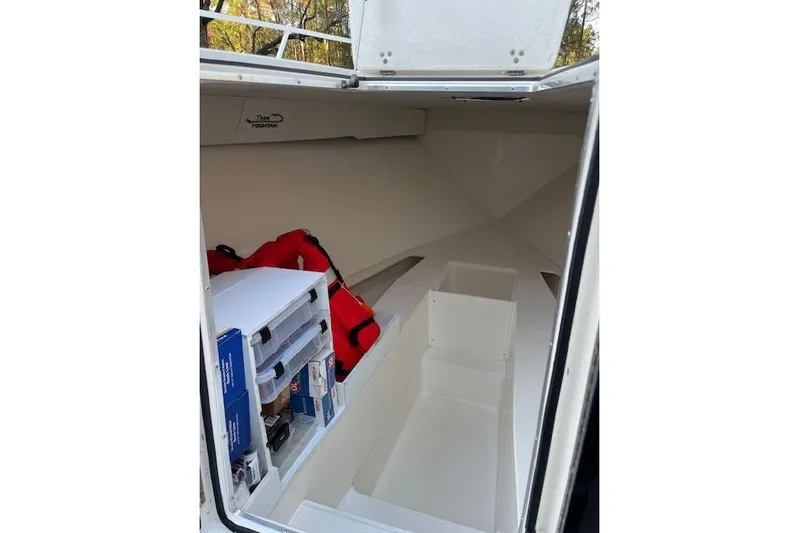 Sashimi Yacht Photos Pics 2006 Fountain 38 Tournament Edition boat interior with storage and safety equipment.