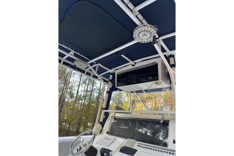 Sashimi Yacht Photos Pics 2006 Fountain 38 Tournament Edition boat interior with navigation equipment and canopy.