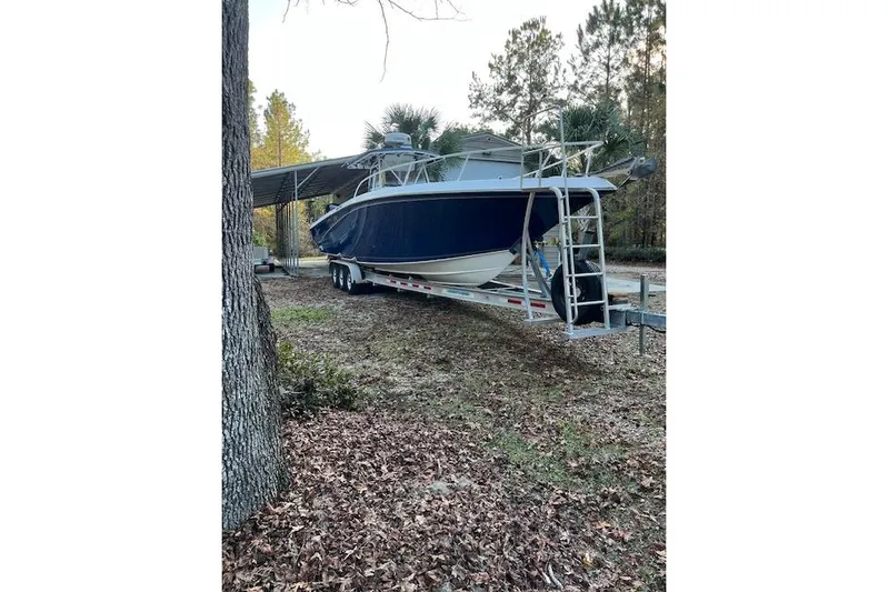 Sashimi Yacht Photos Pics 2006 Fountain 38 Tournament Edition boat on trailer in wooded area.