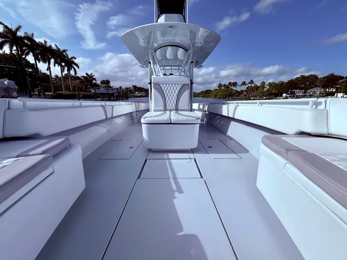  Yacht Photos Pics 2024 Contender 39 ST boat interior with sleek seating and open deck design.