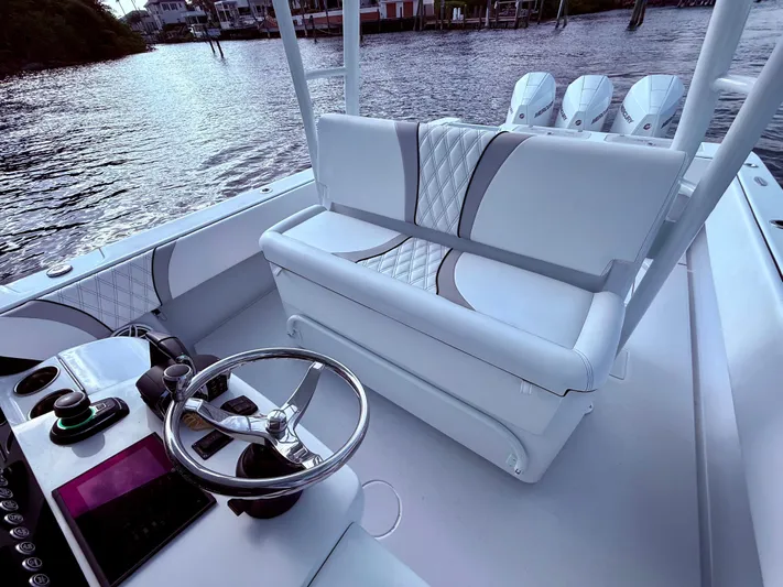  Yacht Photos Pics 2024 Contender 39 ST boat interior with sleek seating and modern controls.