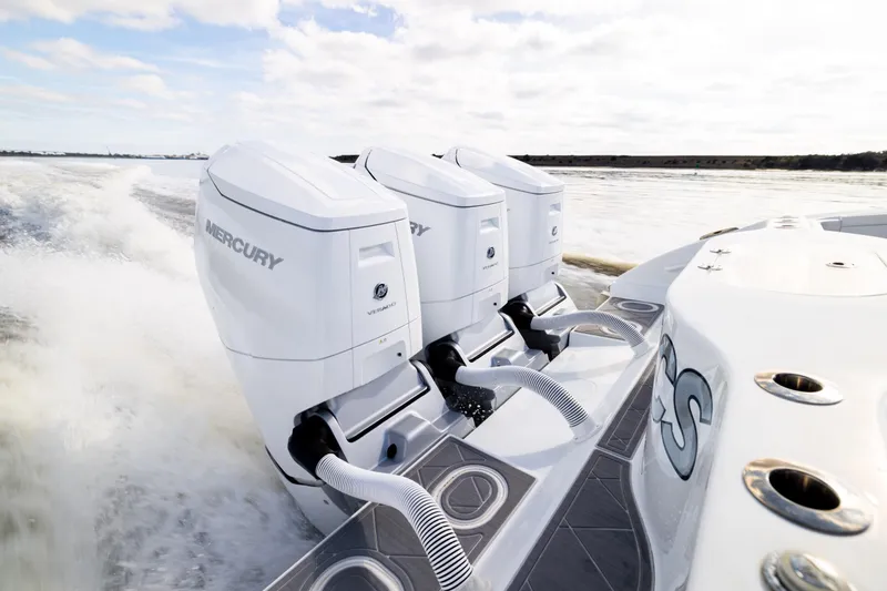 Fishistics Yacht Photos Pics 2024 Yellowfin 42 Offshore boat with triple Mercury outboard engines on water.