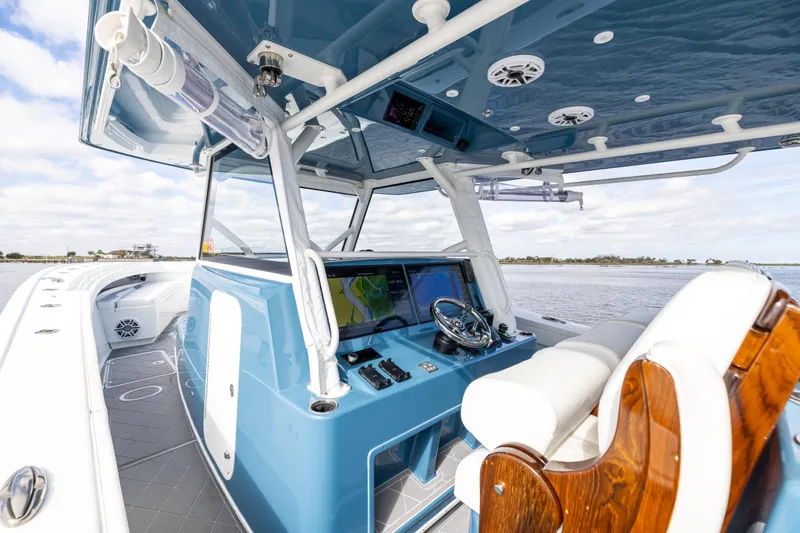 Fishistics Yacht Photos Pics 2024 Yellowfin 42 Offshore boat interior with modern helm and navigation system.