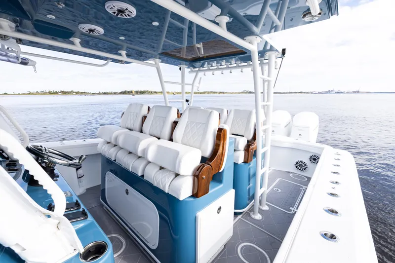 Fishistics Yacht Photos Pics 2024 Yellowfin 42 Offshore boat interior with luxurious seating and ocean view.