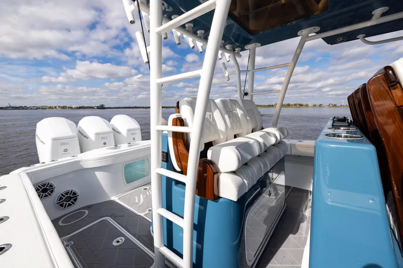 Fishistics Yacht Photos Pics 2024 Yellowfin 42 Offshore boat interior with seating and outboard motors.