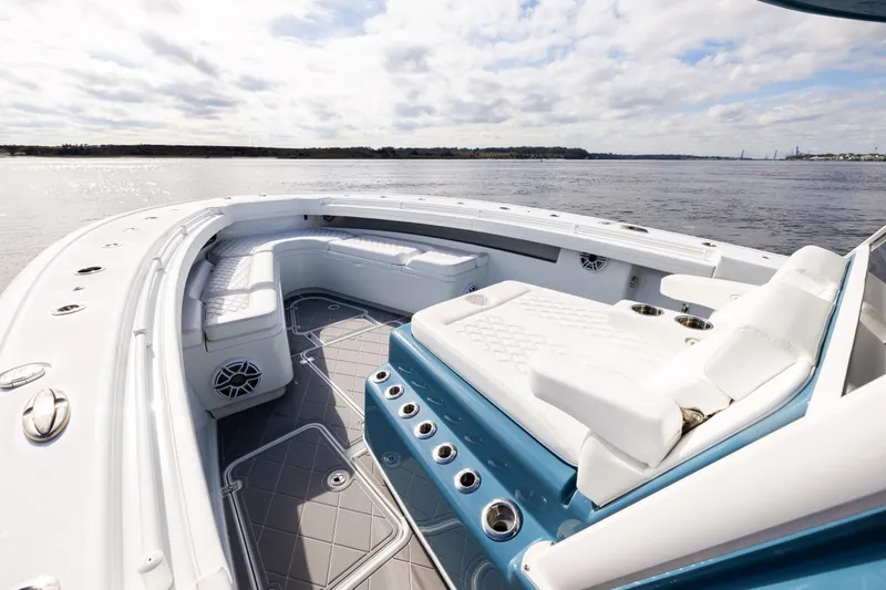 Fishistics Yacht Photos Pics 2024 Yellowfin 42 Offshore boat interior with luxurious seating and ocean view.