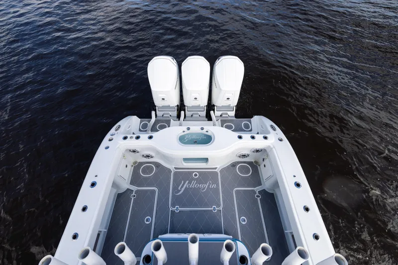 Fishistics Yacht Photos Pics 2024 Yellowfin 42 Offshore boat with triple engines on open water.