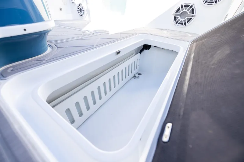 Fishistics Yacht Photos Pics 2024 Yellowfin 42 Offshore boat storage compartment with sleek design and modern features.