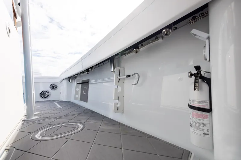 Fishistics Yacht Photos Pics 2024 Yellowfin 42 Offshore boat interior with fire extinguisher and speakers.