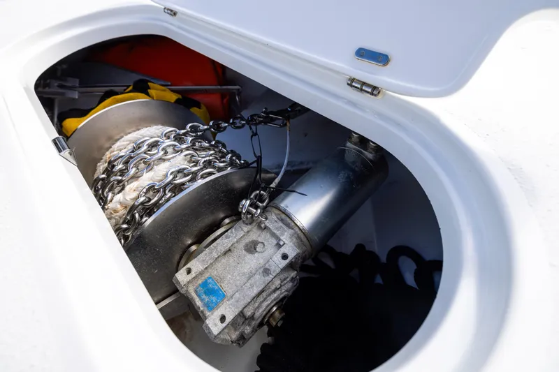 Fishistics Yacht Photos Pics 2024 Yellowfin 42 Offshore boat anchor chain and winch in storage compartment.