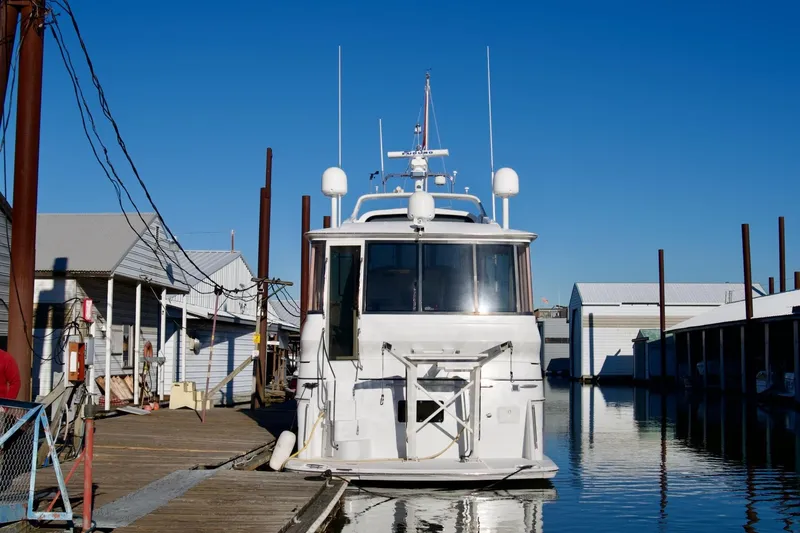  Yacht Photos Pics 2000 Carver 506 Motor Yacht docked at marina under clear blue sky.
