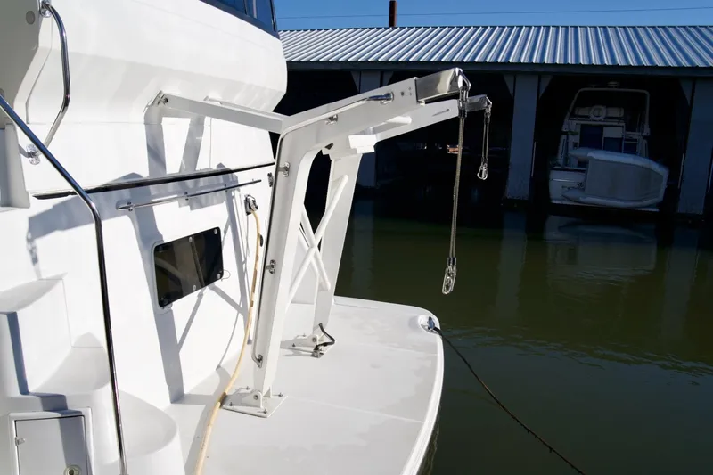  Yacht Photos Pics Carver 506 Motor Yacht 2000 with davit system, docked in marina.