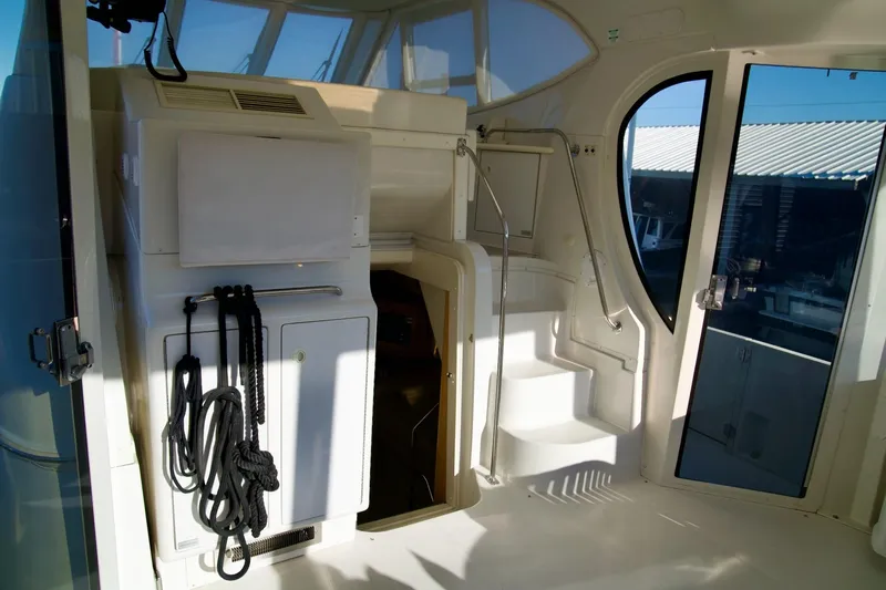  Yacht Photos Pics Interior view of 2000 Carver 506 Motor Yacht with stairs and nautical ropes.