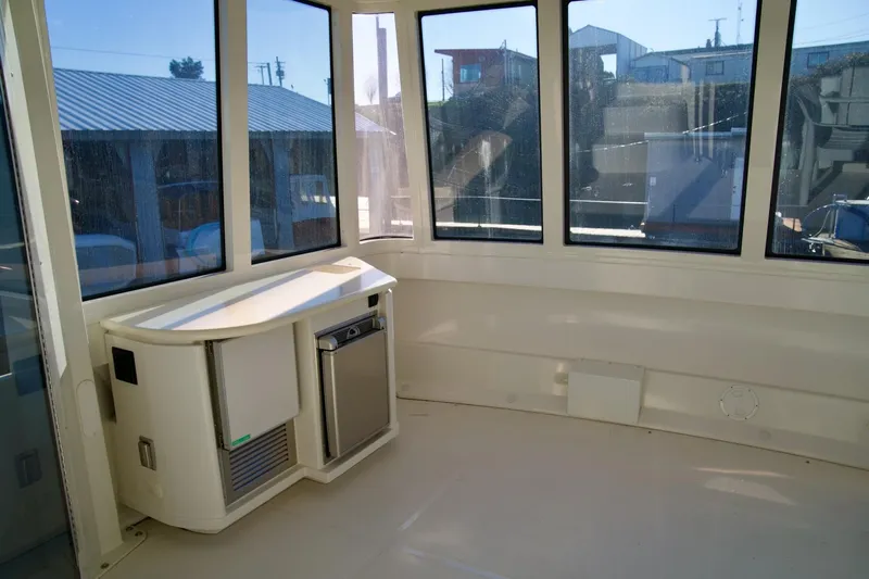  Yacht Photos Pics Interior of 2000 Carver 506 Motor Yacht with windows and compact kitchenette.