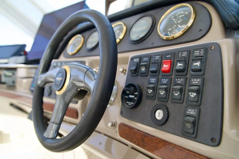 Yacht Photos Pics Steering wheel and control panel of 2000 Carver 506 Motor Yacht.